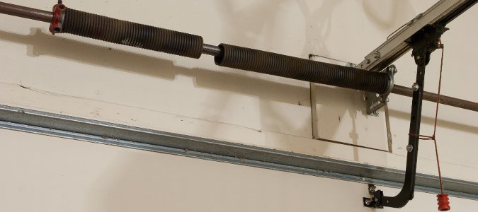 torsion garage door repair needed